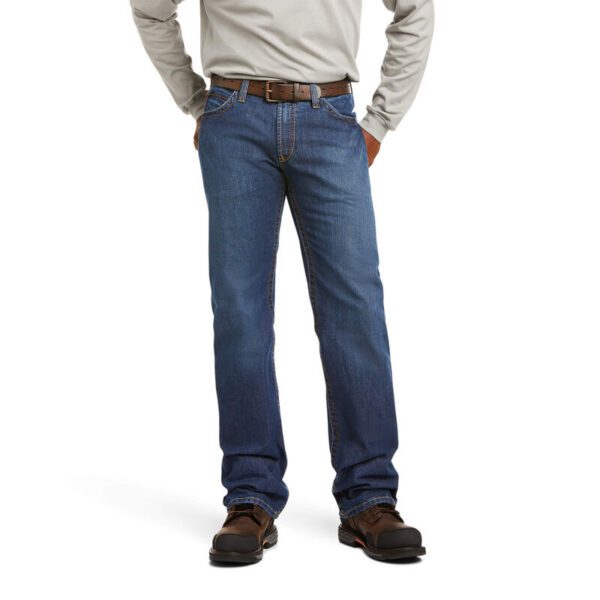 A person wearing jeans with brown shoes