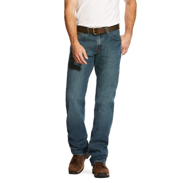 A person wearing a blue jeans on a brown shoes