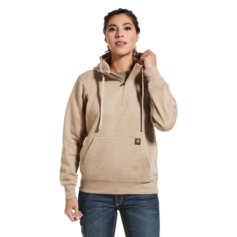 A woman wearing a brown hoodie and jeans